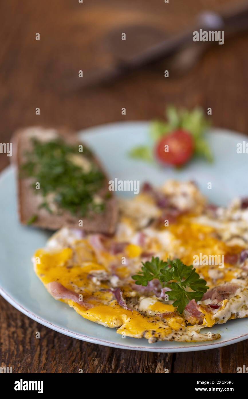 Scrambled eggs on a blue plate Stock Photo