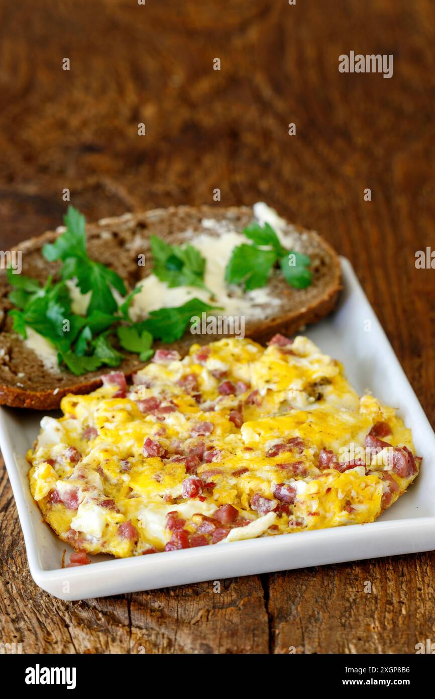 Scrambled eggs on a white plate Stock Photo