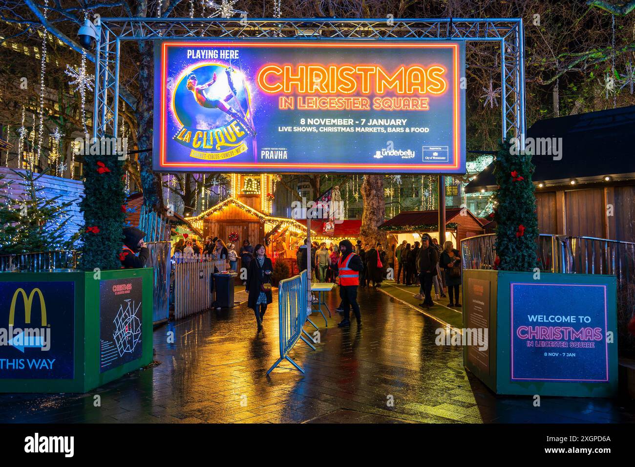 Christmas market at night in Leicester square in London, UK Stock Photo