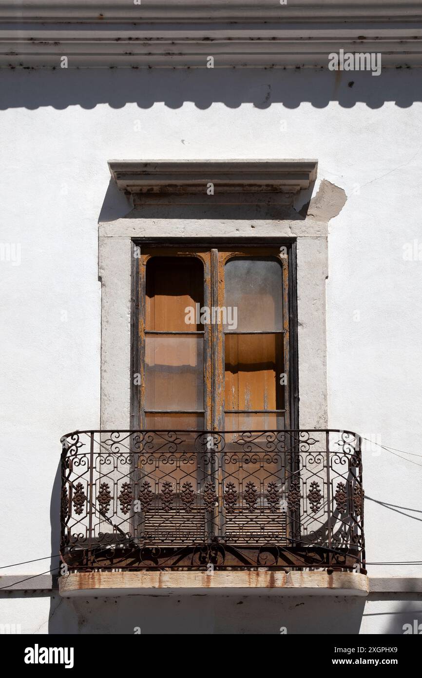 Rusted Balcony Railing and Broken Doors Stock Photo - Alamy