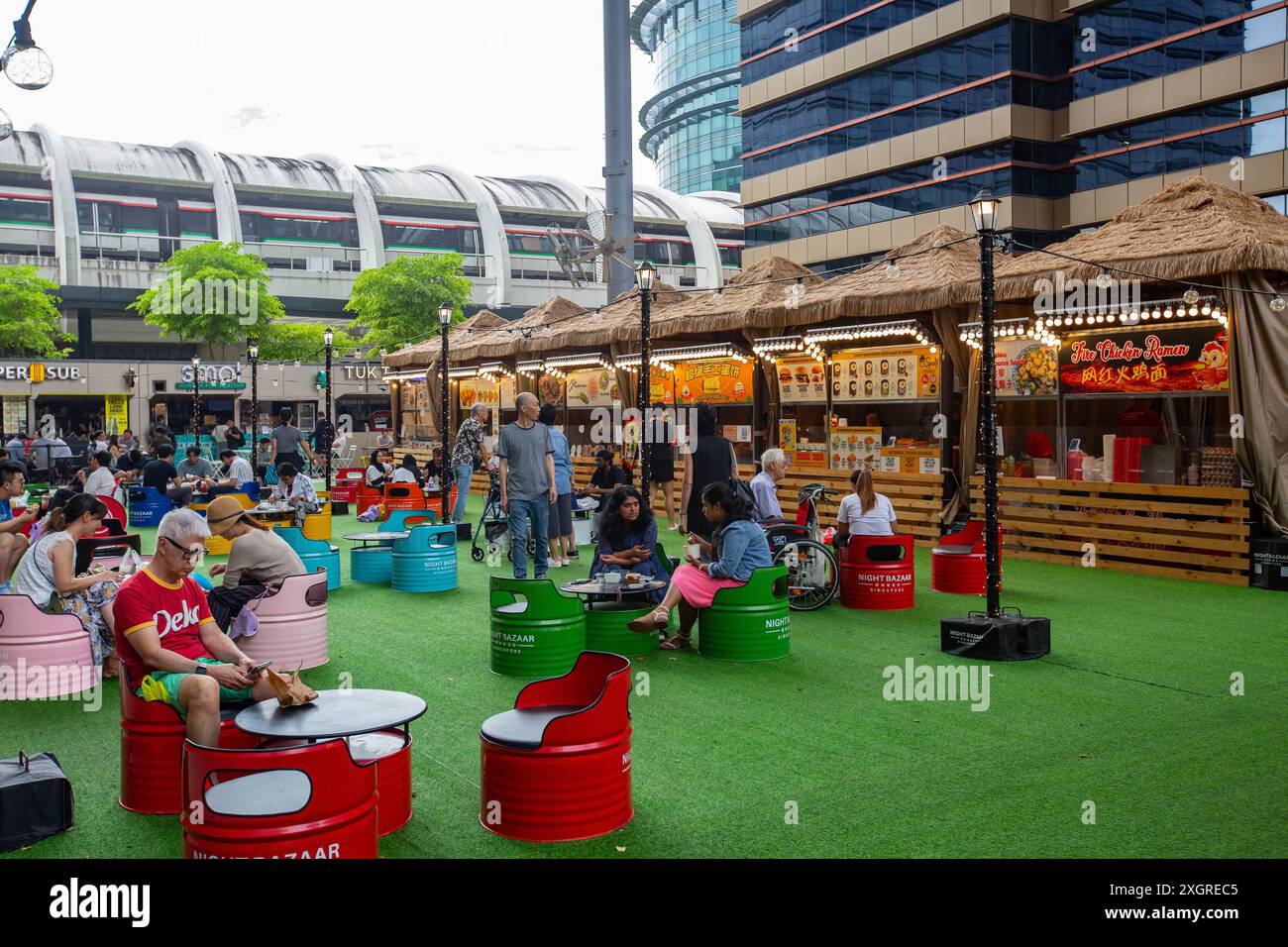 Customers gather around the street food venue during the day in Singapore Stock Photo