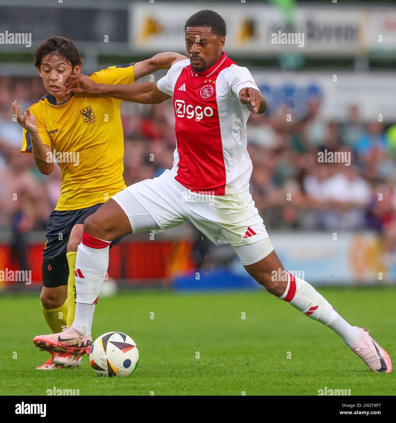 Oldebroek, Netherlands. 09th July, 2024. OLDEBROEK, NETHERLANDS - JULY 9: Rihito Yamamoto of STVV, Chuba Akpom of AFC Ajax during the Pre-season friendly match between AFC Ajax and STVV at Sportpark Bovenmolen on July 9, 2024 in Oldebroek, Netherlands. (Photo by Ben Gal/Orange Pictures) Credit: Orange Pics BV/Alamy Live News Stock Photo