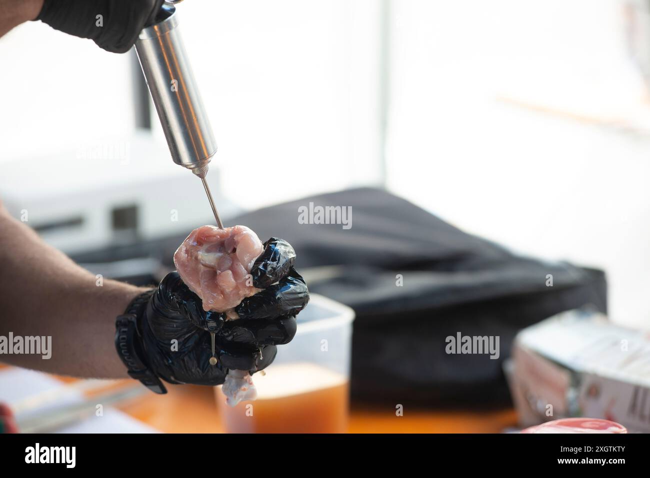 Chicken Legs Injecting Marinade with a Syringe Stock Photo - Alamy