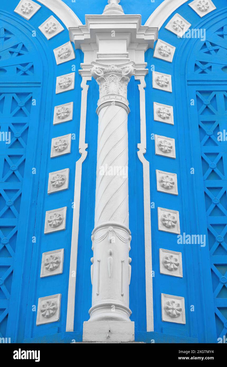 486 White column and moldings on the Cine Cuba movie theater azure-blue west side facade, Eclectic style building from the early 1900s. Santiago-Cuba. Stock Photo