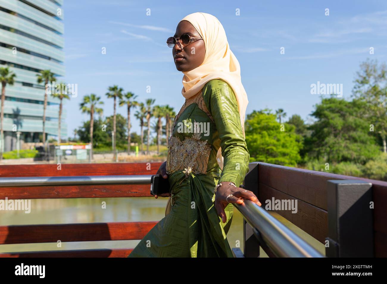 Elegant Woman Dressed In A Green Ornate Outfit With A Matching Hijab elegant-woman-dressed-in-a-green-ornate-outfit-with-a-matching-hijab