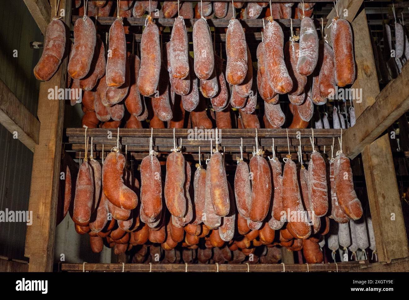 Racks of Sobrasada and other cured sausages aged in a traditional meat ...