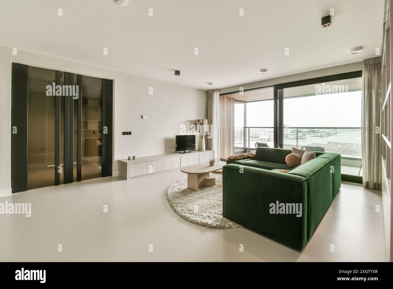 Curated visual reference: Elegant Modern Apartment Interior Featuring A Green Velvet Sofa White Photo Inspiration