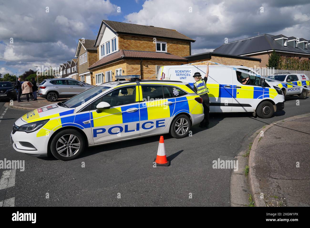 A view of the scene in Ashlyn Close, Bushey, Hertfordshire, where the wife  and two daughters of a BBC sports commentator have been killed in a  crossbow attack at their home. Carol