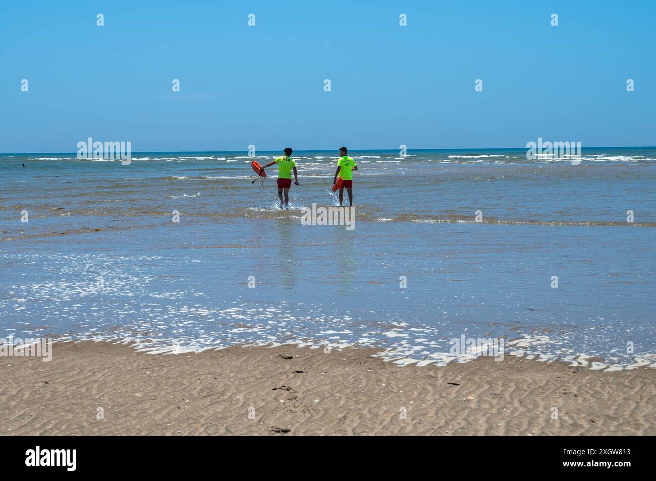 Baywatch lifeguards at Isla Canela Beach during a summer day. Isla ...