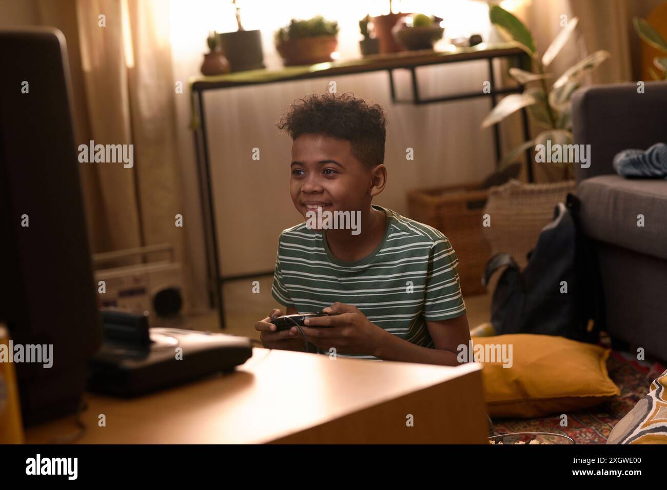 African american boy seated hi-res stock photography and images - Alamy