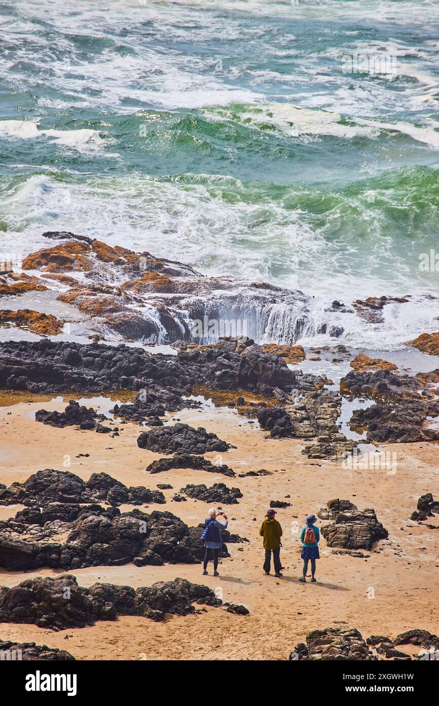 People Exploring Rocks People exploring rocky coast hi-res stock photography and images - Alamy