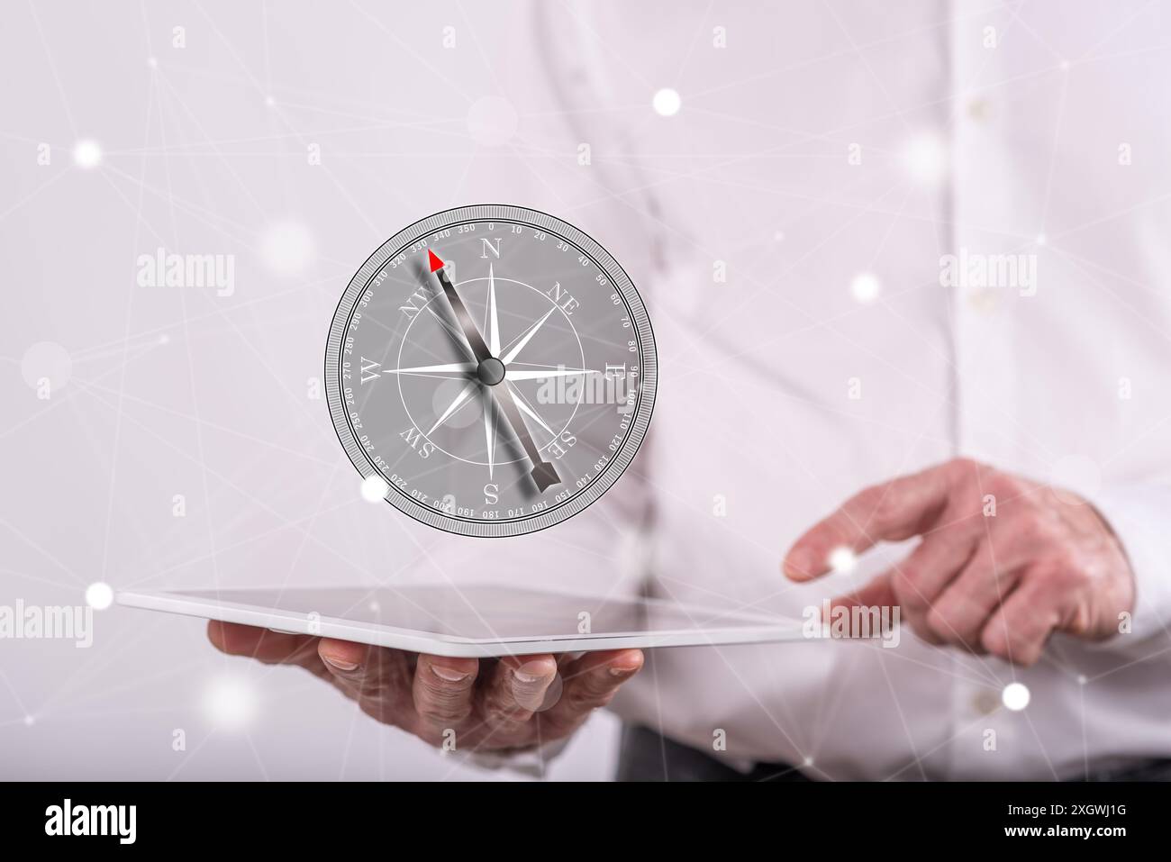 Right direction concept above a tablet held by a man in background Stock Photo
