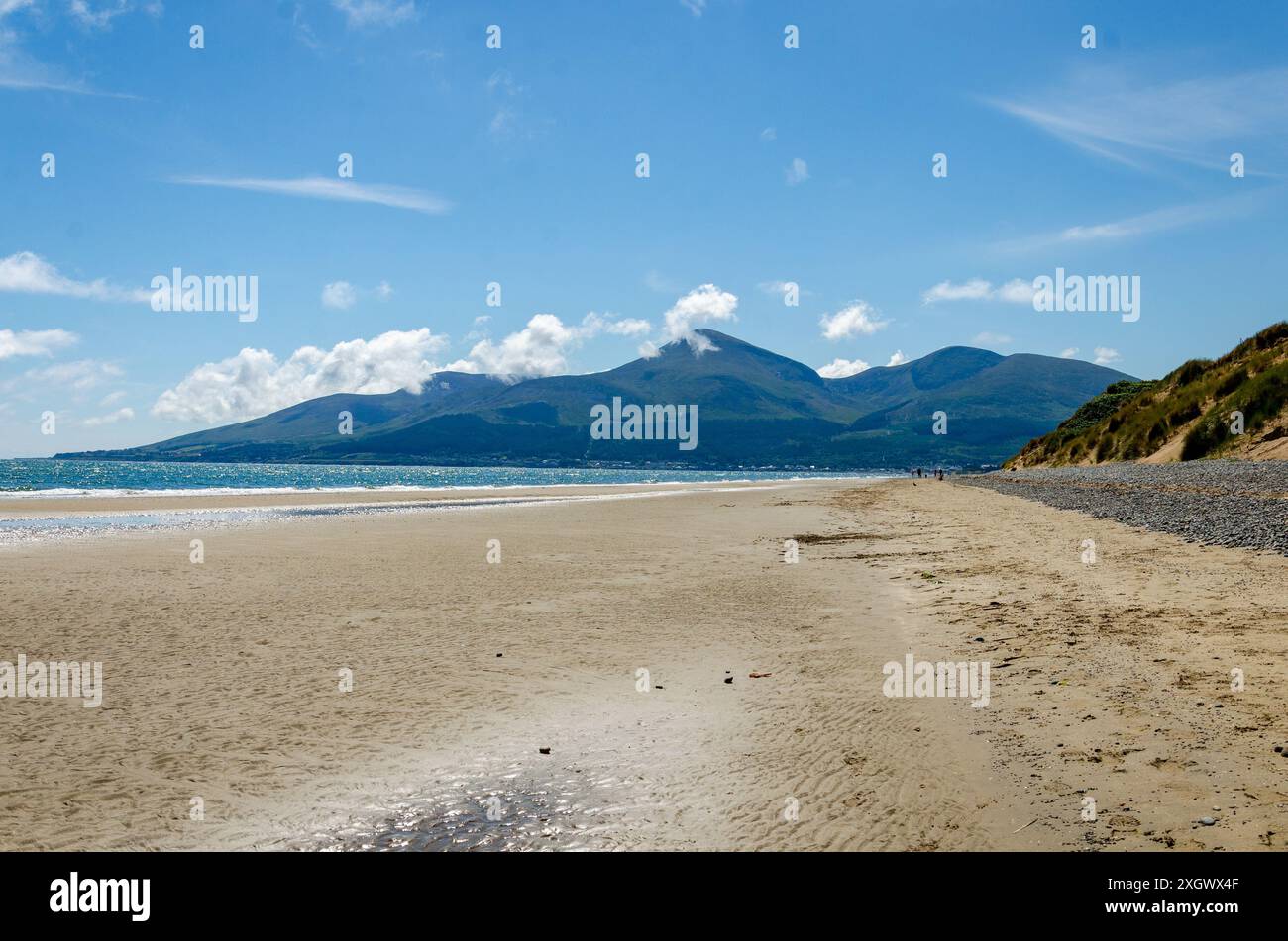 View of the Mourne Mountains from Murlough beach with blue sky and ...