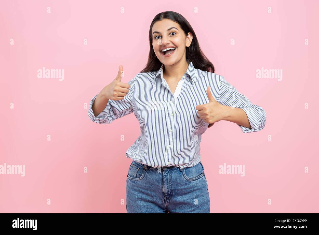 Overjoyed positive Indian woman gesturing thumbs up Stock Photo - Alamy