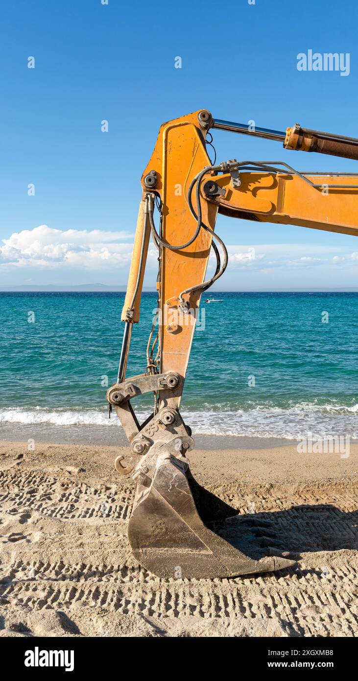 A excavator standing on a beautiful Mediterranean beach Stock Photo - Alamy
