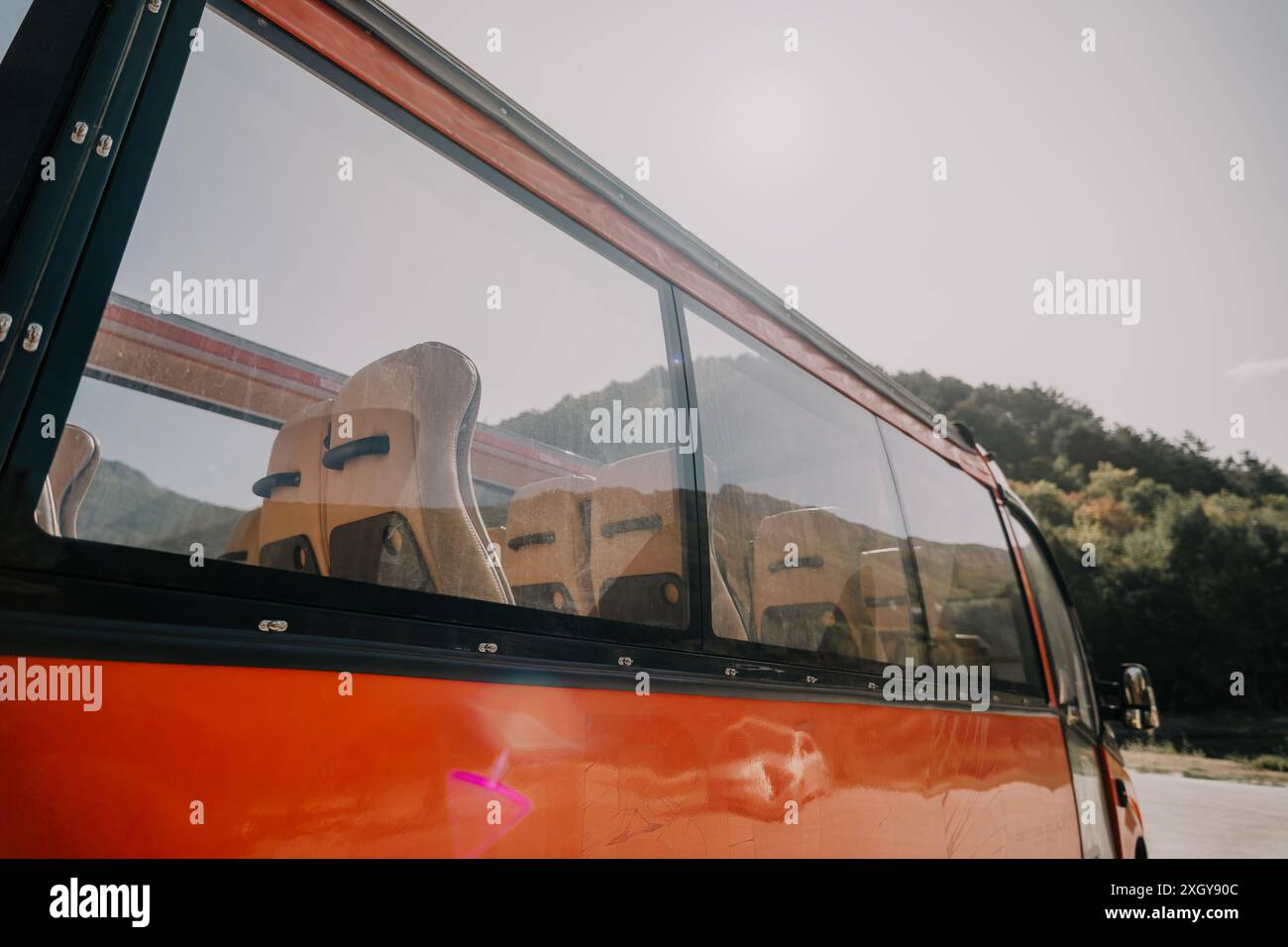 Red Bus Window with Empty Seats Stock Photo - Alamy