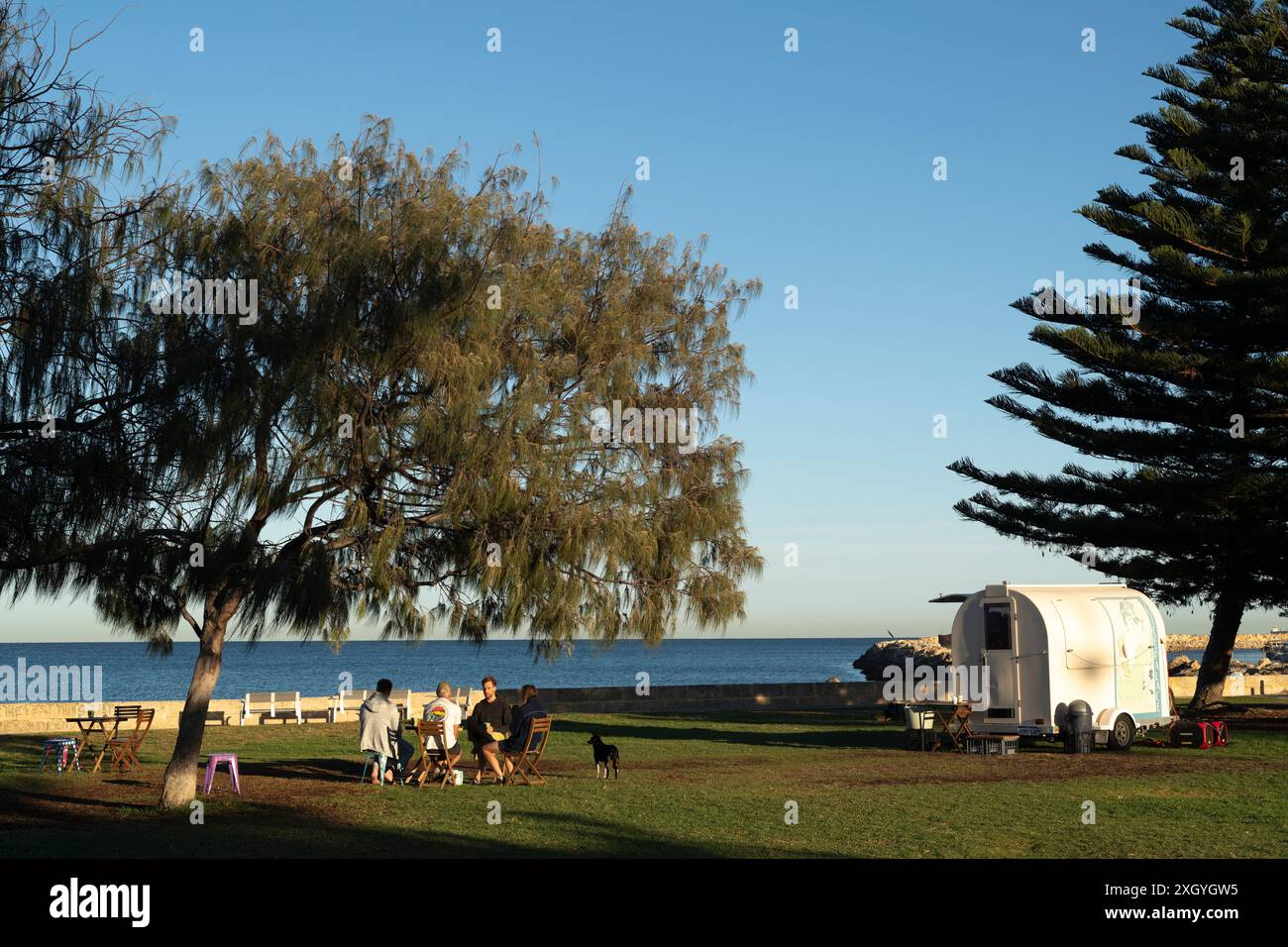 People relaxing in the earling morning at South Fremantle beach with ...