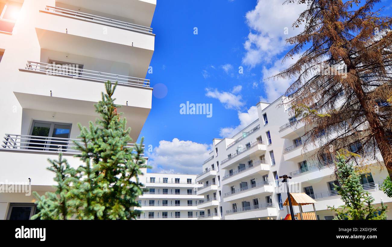 Modern residential building with new apartments in a green residential ...
