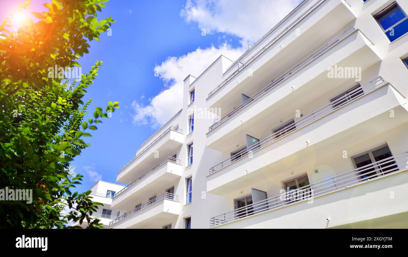 Modern residential building with new apartments in a green residential ...