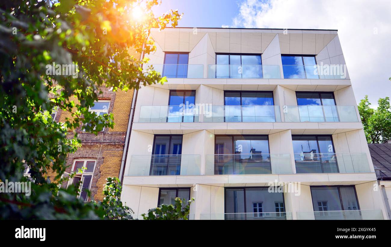 Modern residential building with new apartments in a green residential ...