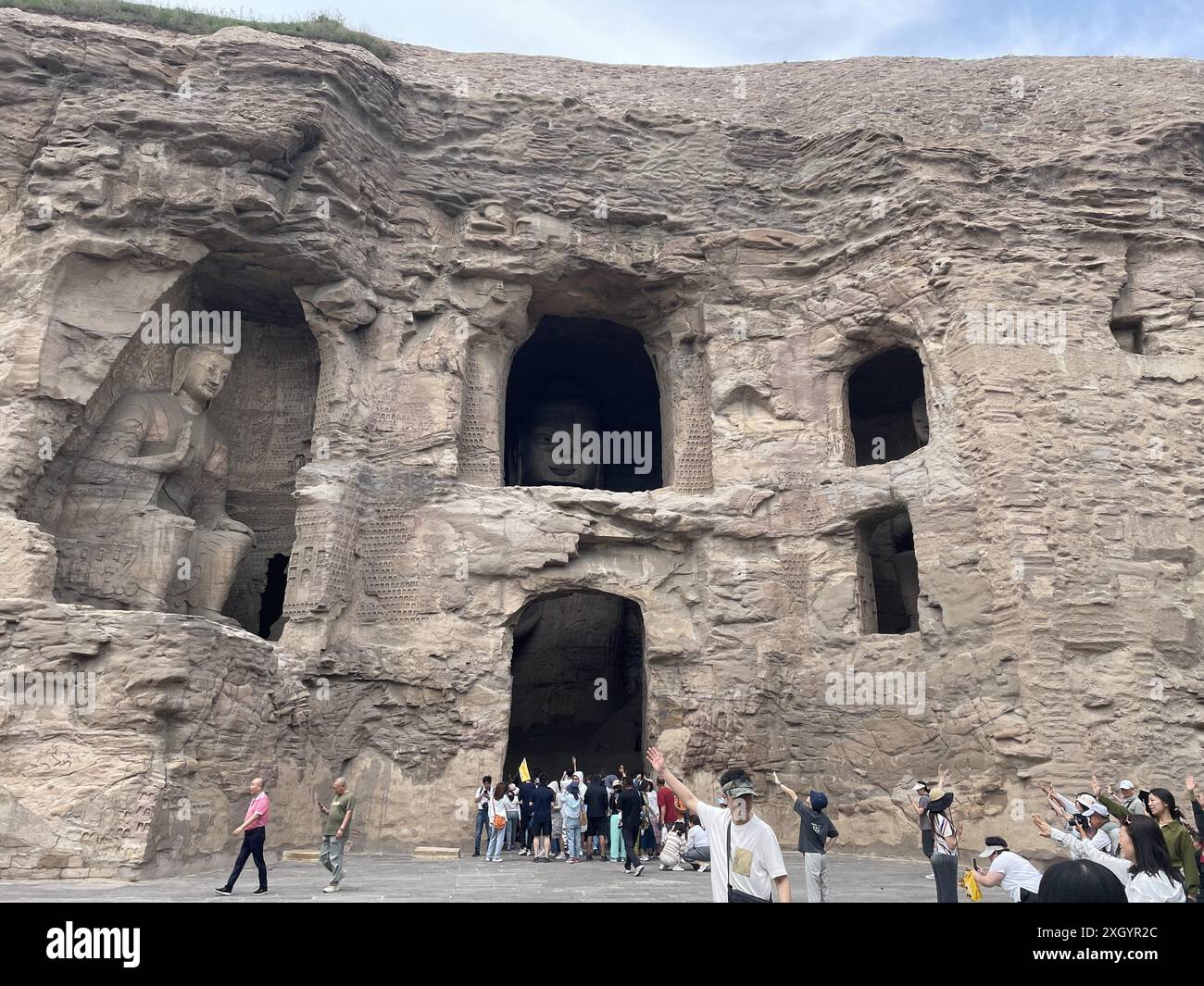 Tourists visit the Yungang Grottoes in Datong City, north China's Shanxi Province, 8 July, 2024. (Photo by Imaginechina/Sipa USA) Stock Photo