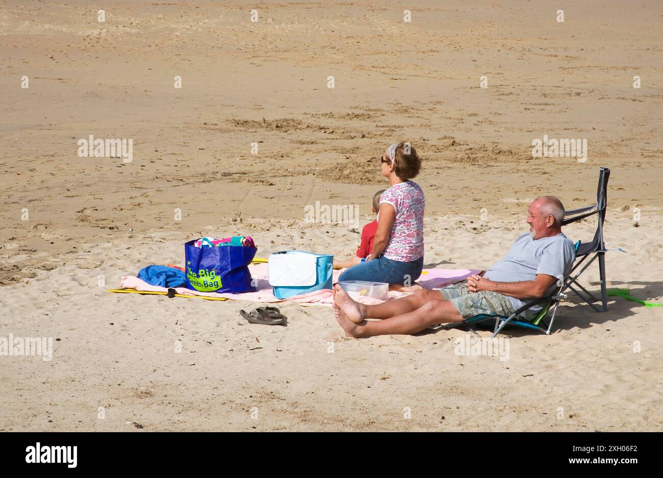 relaxing on the beach at trevone in north cornwall Stock Photo