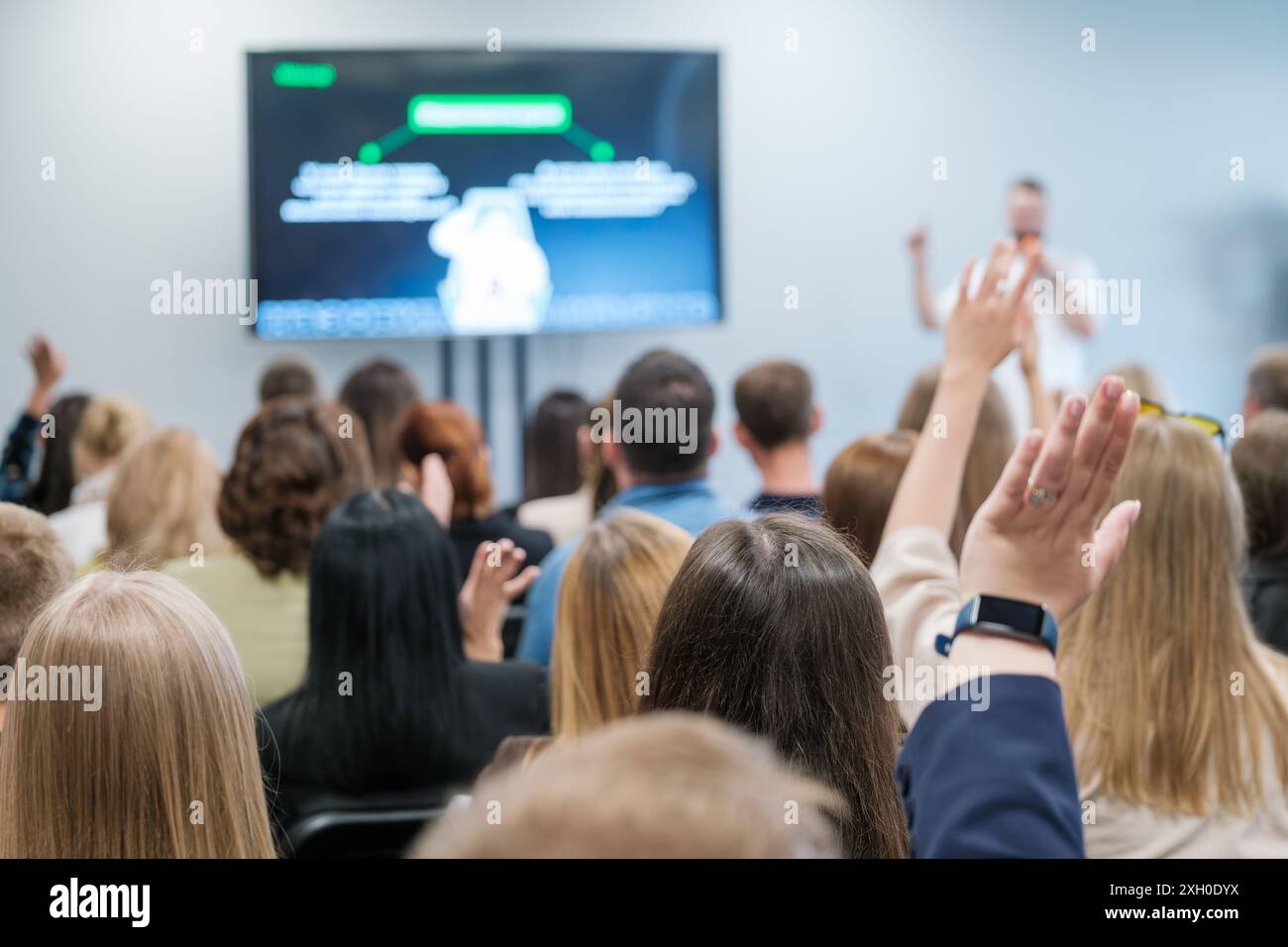 Hands raise speaker hi-res stock photography and images - Alamy