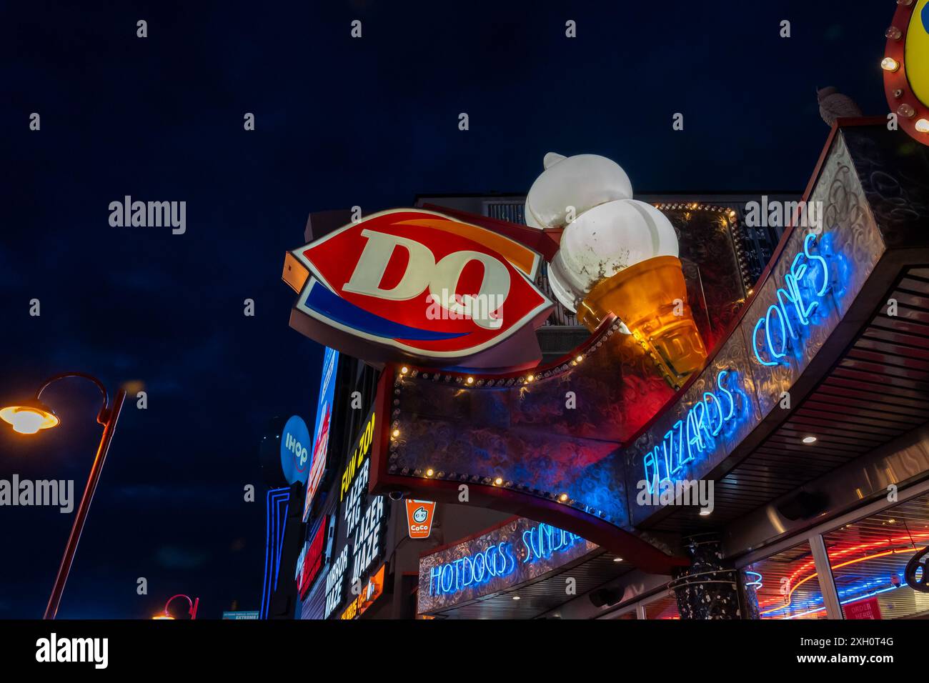 Niagara Falls, ON, Canada - December 8, 2023: A Dairy Queen store at night at Clifton Hill. Niagara Falls, ON, Canada. Stock Photo