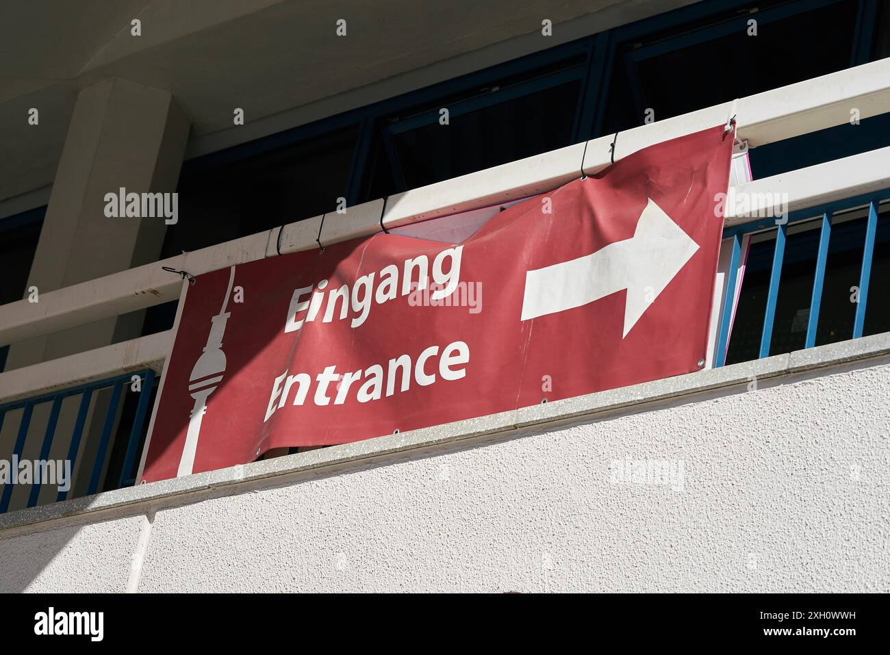Signpost to the entrance of the television tower on Alexanderplatz in ...