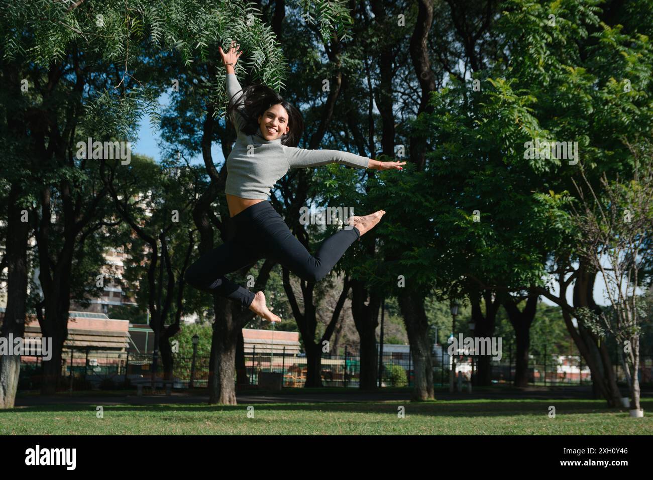 Excited young woman jumping in hi-res stock photography and images - Alamy