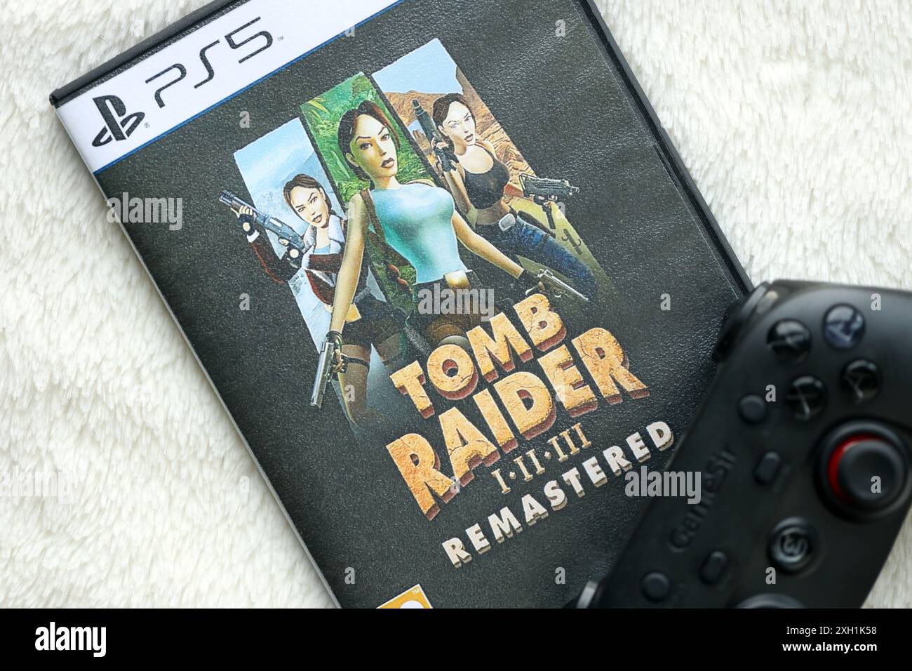 KYIV, UKRAINE JUNE 26, 2024 Tomb Raider 123 Remastered PS5 video game disc box for console