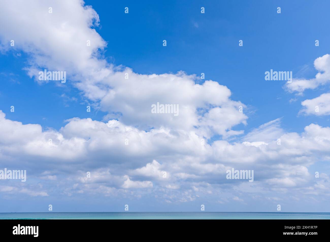 Blue sky and white clouds over sea nature background Stock Photo - Alamy