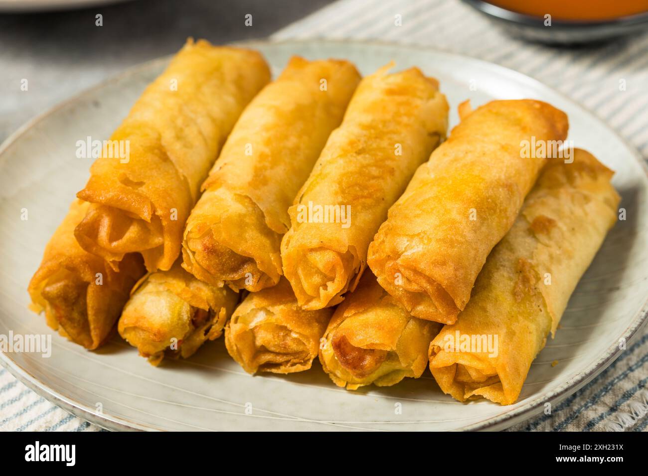 Deep Fried Filipino Pork Lumpia with Dipping Sauce Stock Photo