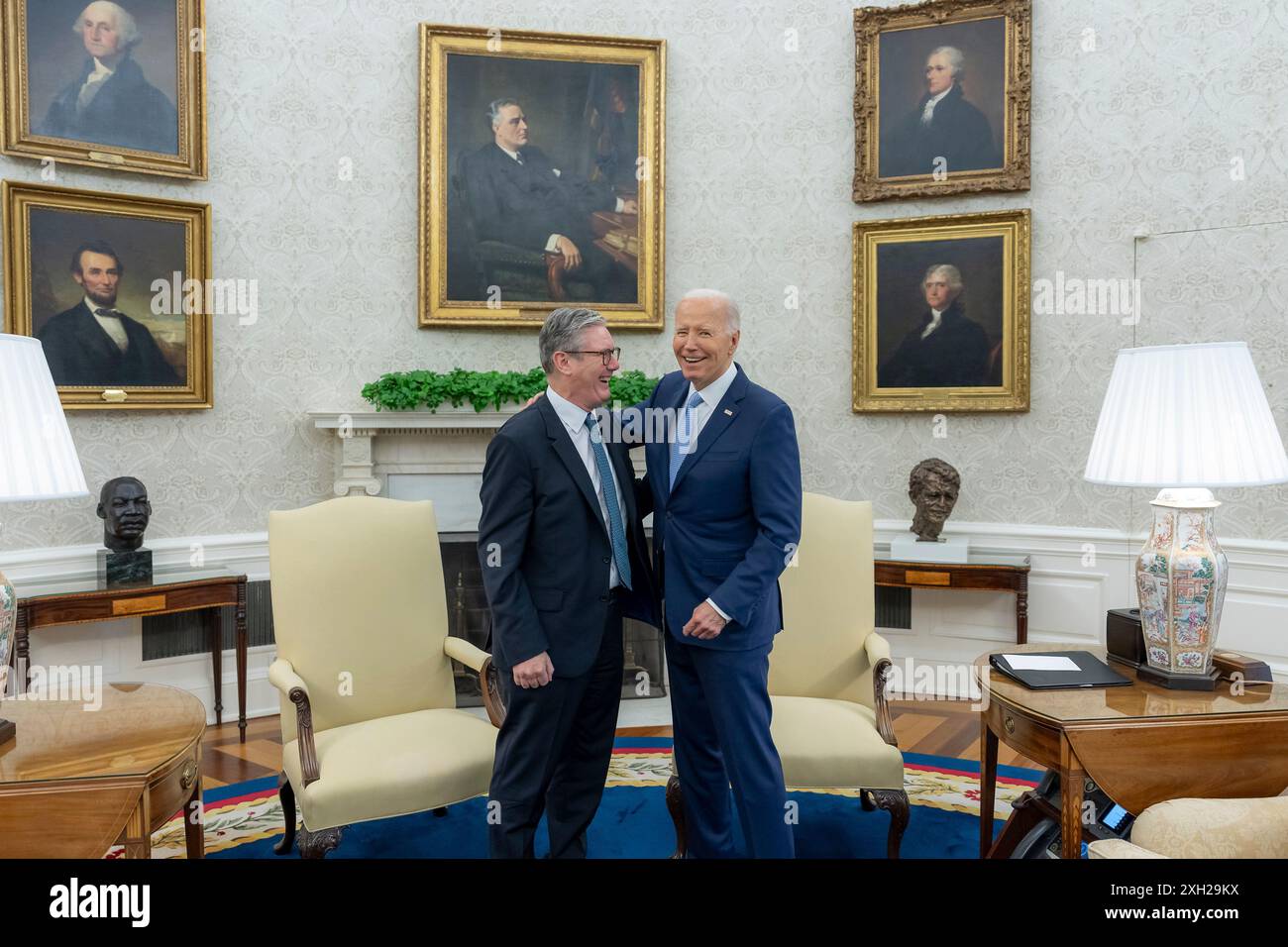 Washington, United States. 10th July, 2024. U.S President Joe Biden, right, embraces British Prime Minister Keir Starmer, left, before their bilateral meeting on the sidelines of the 75th anniversary NATO Summit at the Oval Office of the White House, July 10, 2024 in Washington, DC Credit: Adam Schultz/White House Photo/Alamy Live News Stock Photo