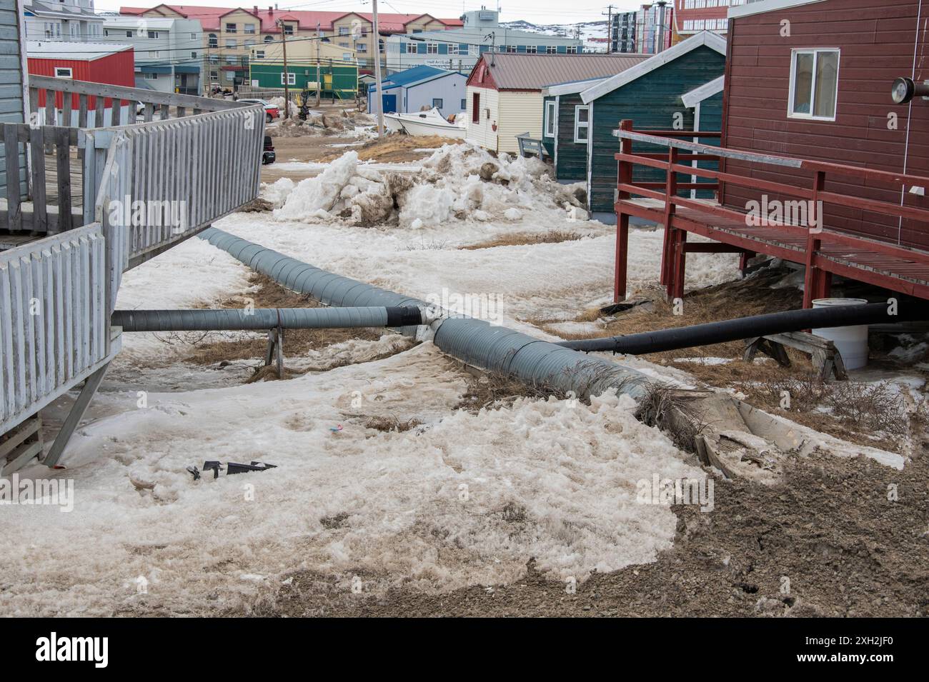 Sewer pipe lines from houses in Iqaluit, Nunavut, Canada Stock Photo