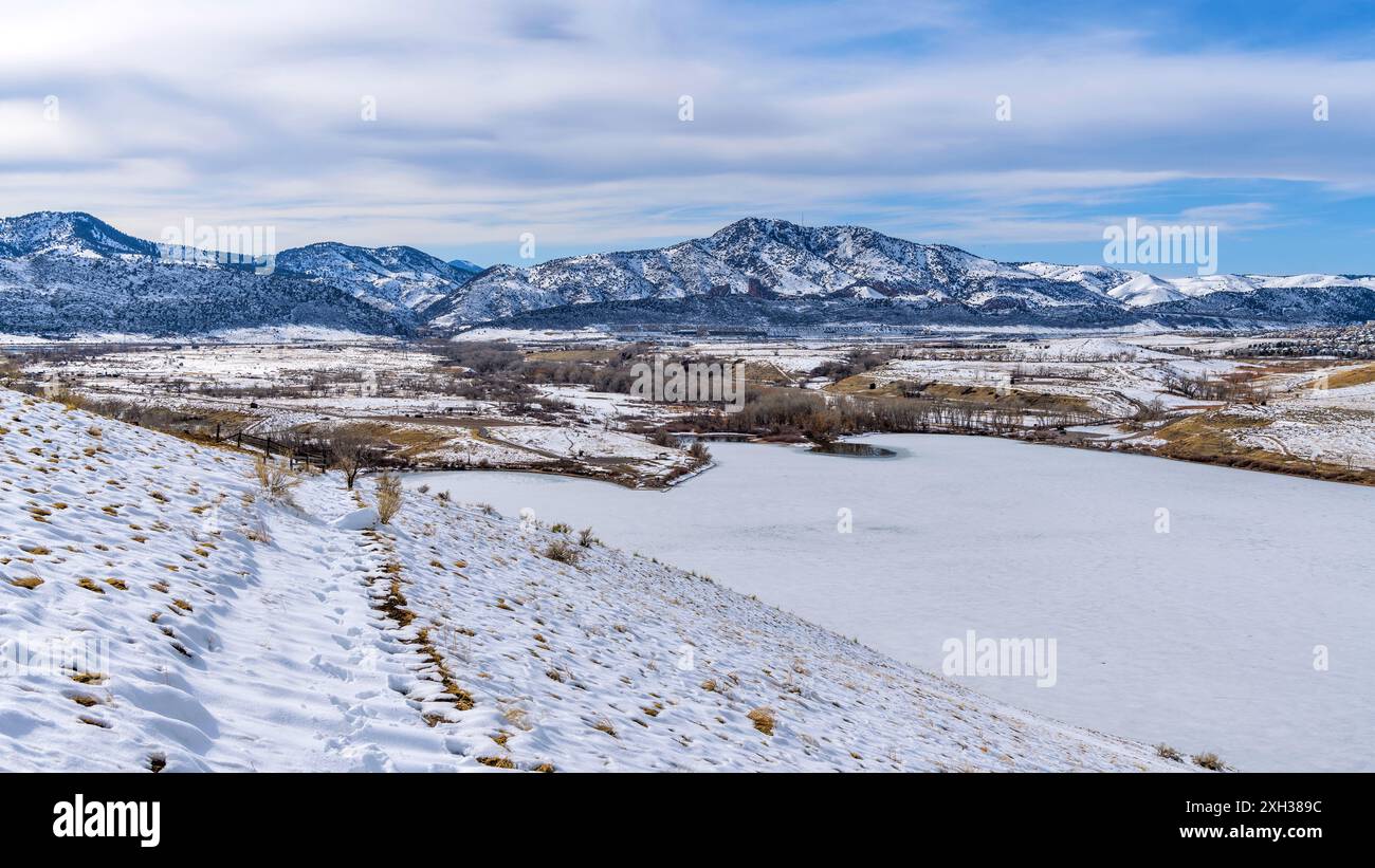 Winter Park - Bright sunny Winter day overview of snow- covered Bear Creek Lake Park, as seen from Mt. Carbon. Denver-Lakewood-Morrison, Colorado, USA. Stock Photo