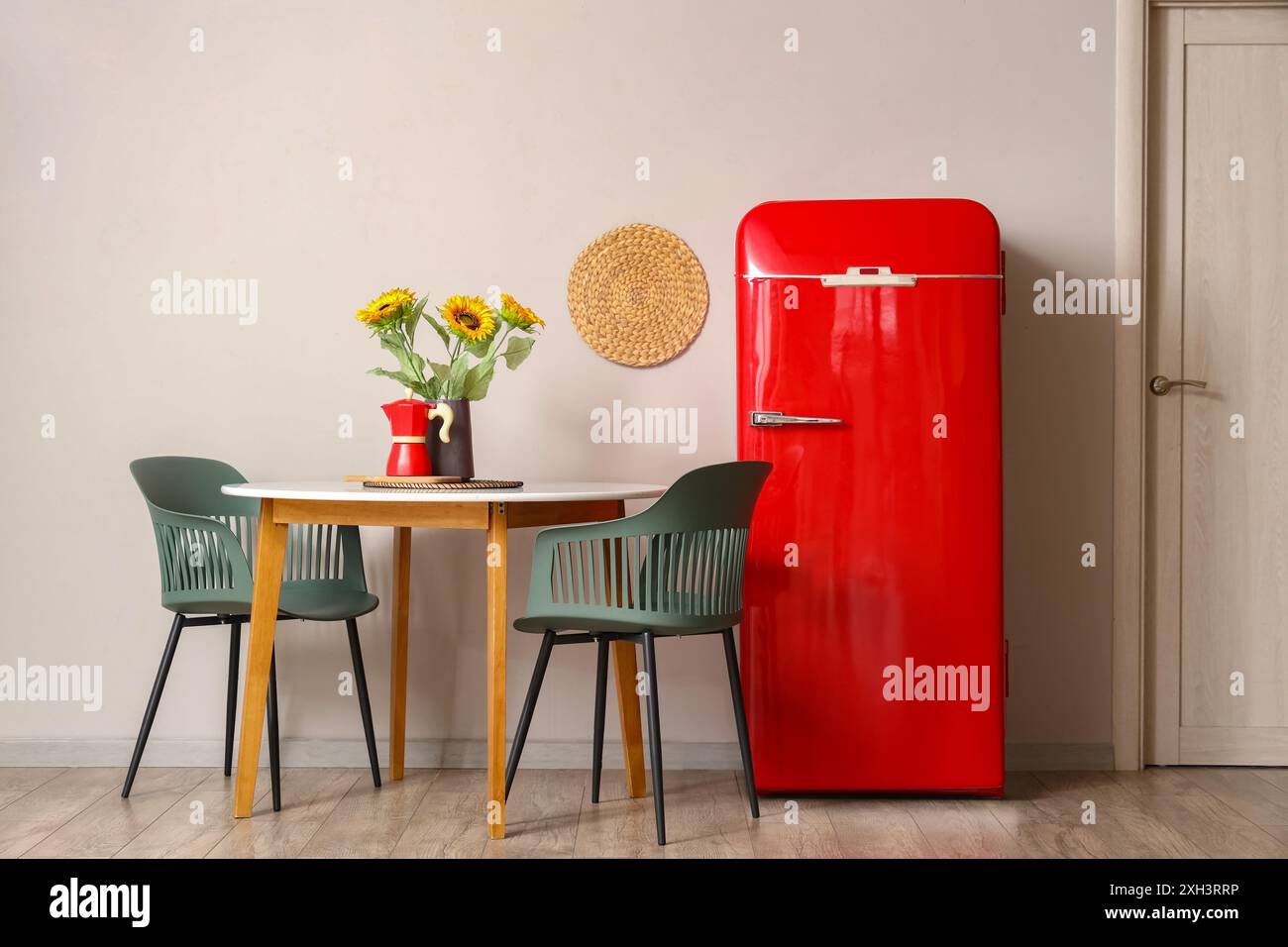 Interior of kitchen with red fridge and dining table with chairs Stock ...