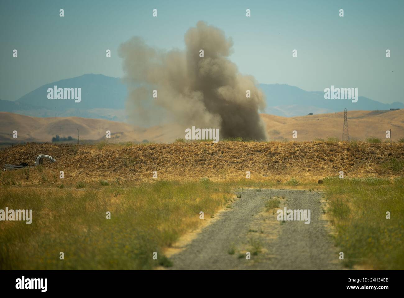 A C-4 explosive is detonated during explosive proficiency training by the U.S. Air Force 60th Civil Engineer Squadron explosive ordnance disposal team on the EOD range at Travis Air Force Base, California, July 8, 2024. Technicians apply classified techniques and special procedures to lessen or totally remove the hazards created by the presence of unexploded ordnance. (U.S. Air Force photo by Airman 1st Class Robert Nichols) Stock Photo