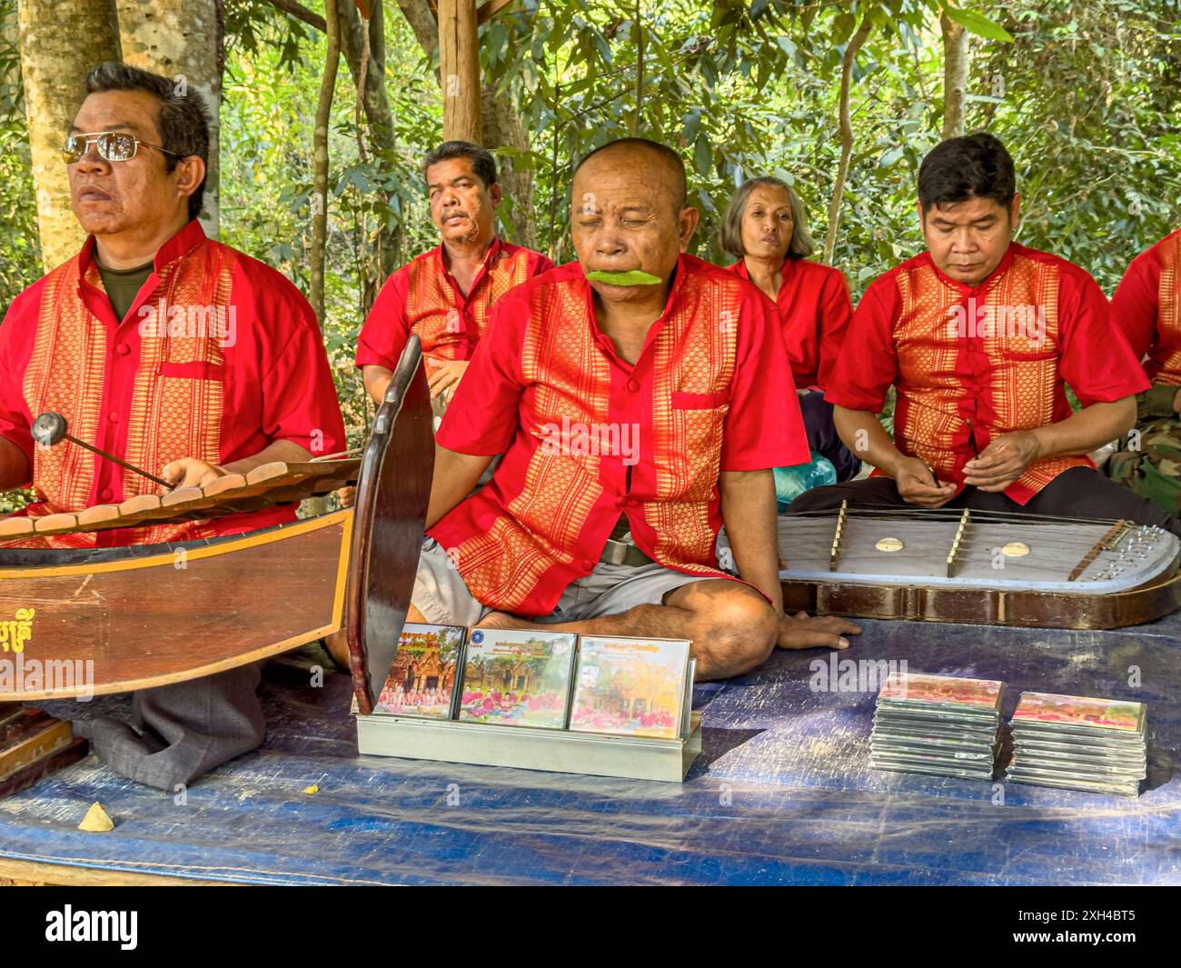 Survivors of the Khmer Rouge play together at Banteay Srei Temple in the area of Angkor, Cambodia. Stock Photo