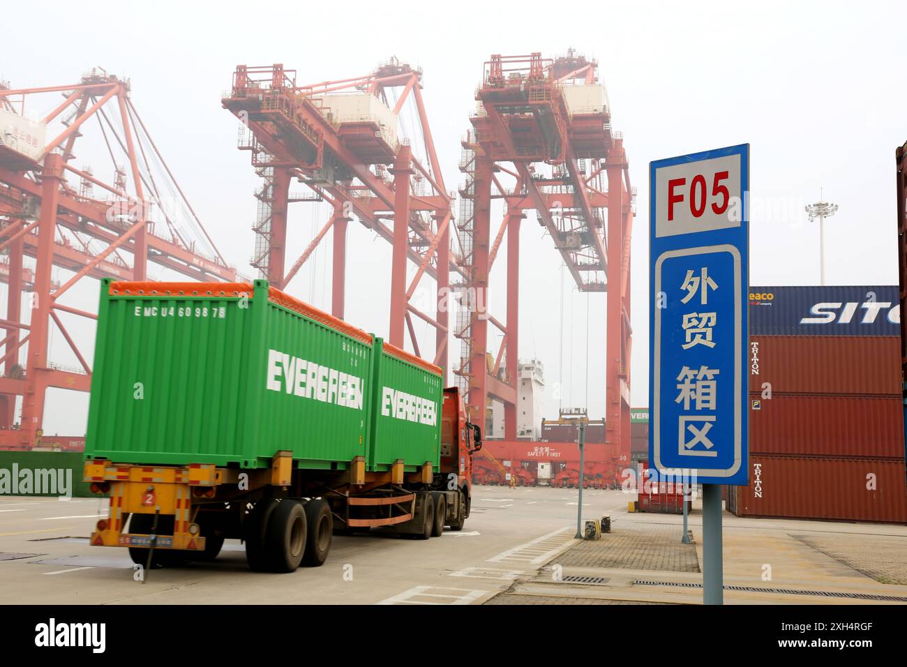 LIANYUNGANG, CHINA - JULY 12, 2024 - Cargo ships dock at the berth for ...