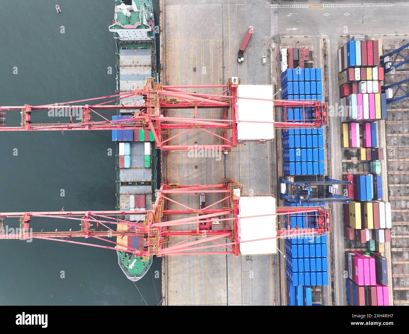 LIANYUNGANG, CHINA - JULY 12, 2024 - Cargo ships dock at the berth for ...
