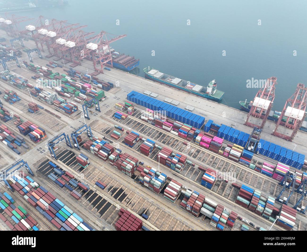 LIANYUNGANG, CHINA - JULY 12, 2024 - Cargo ships dock at the berth for ...