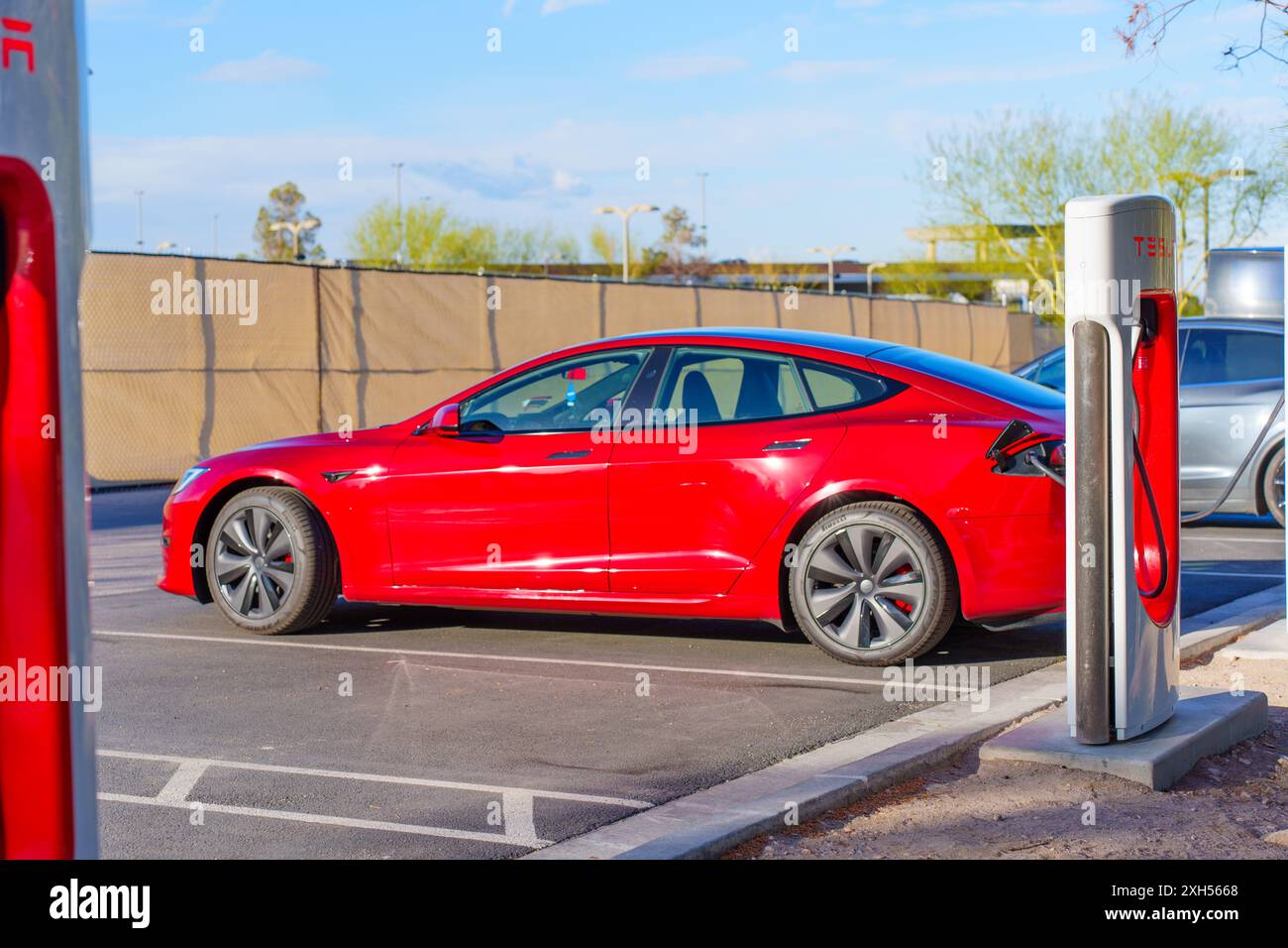 Los Angeles, California April 15, 2024 Red Tesla Model S charging at