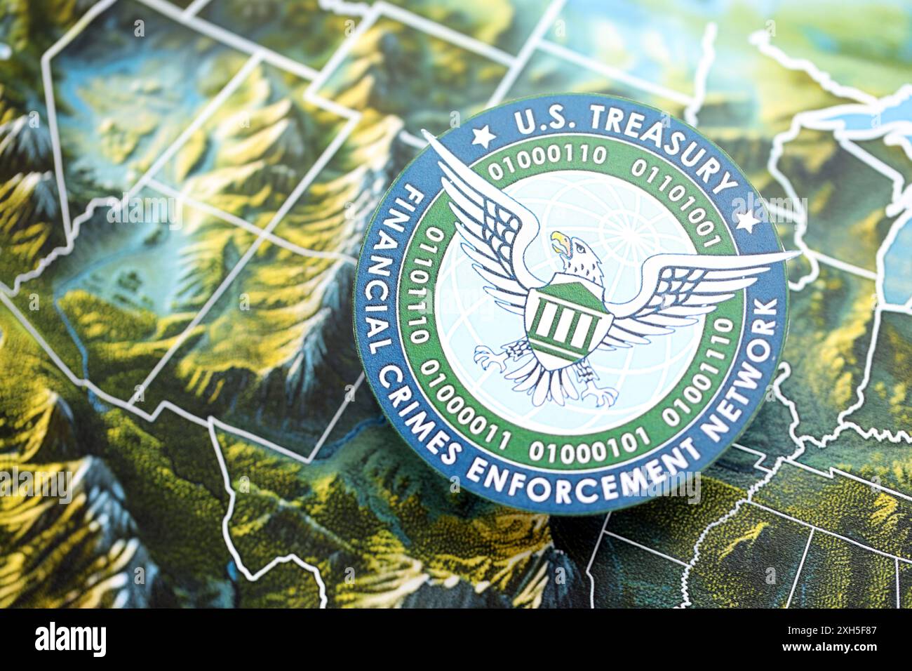 KYIV UKRAINE JUNE 26 2024 U S - Kyiv Ukraine June 26 2024 Us Treasury Financial Crimes Enforcement Network Coat Of Arms On Paper Map Of United States Of America 2XH5F87 