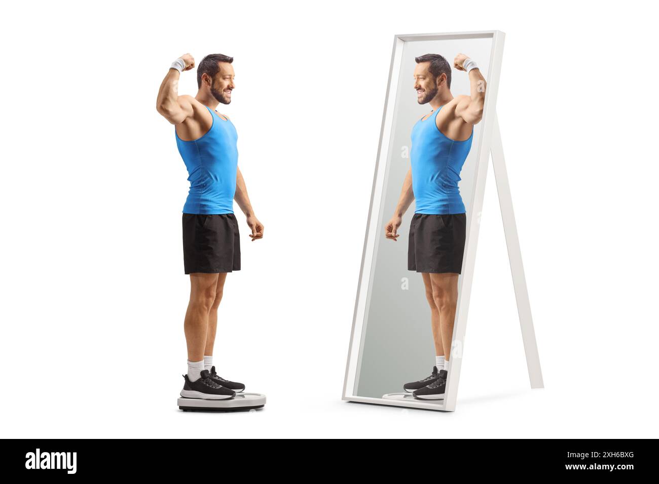 Fit man in sportswear standing on a weight scale and looking at a mirror isolated on white background Stock Photo