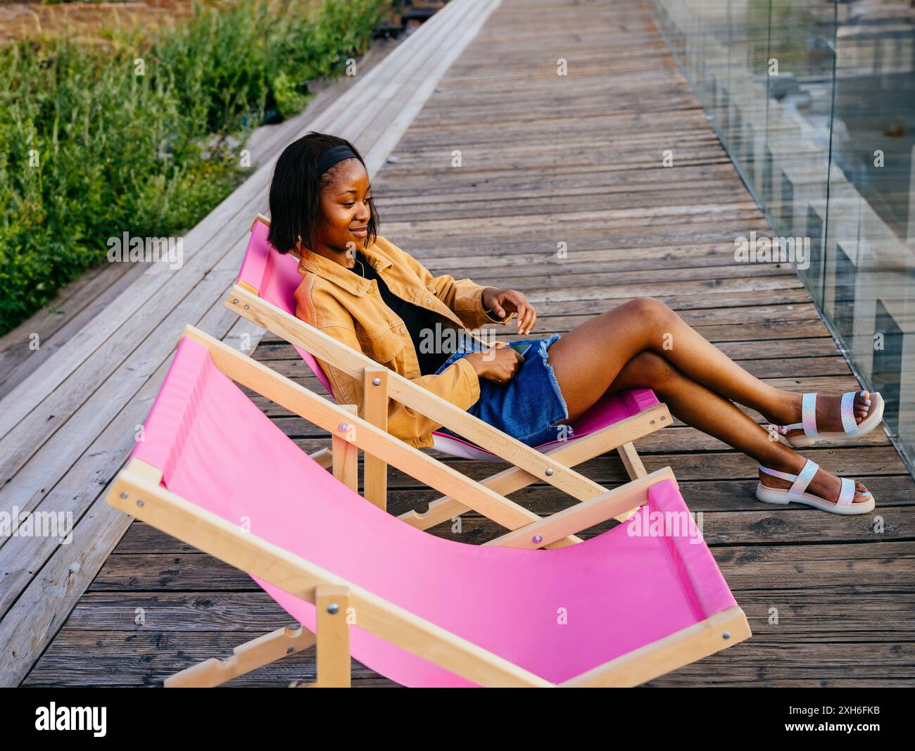 Woman dress sitting chair hi-res stock photography and images - Alamy