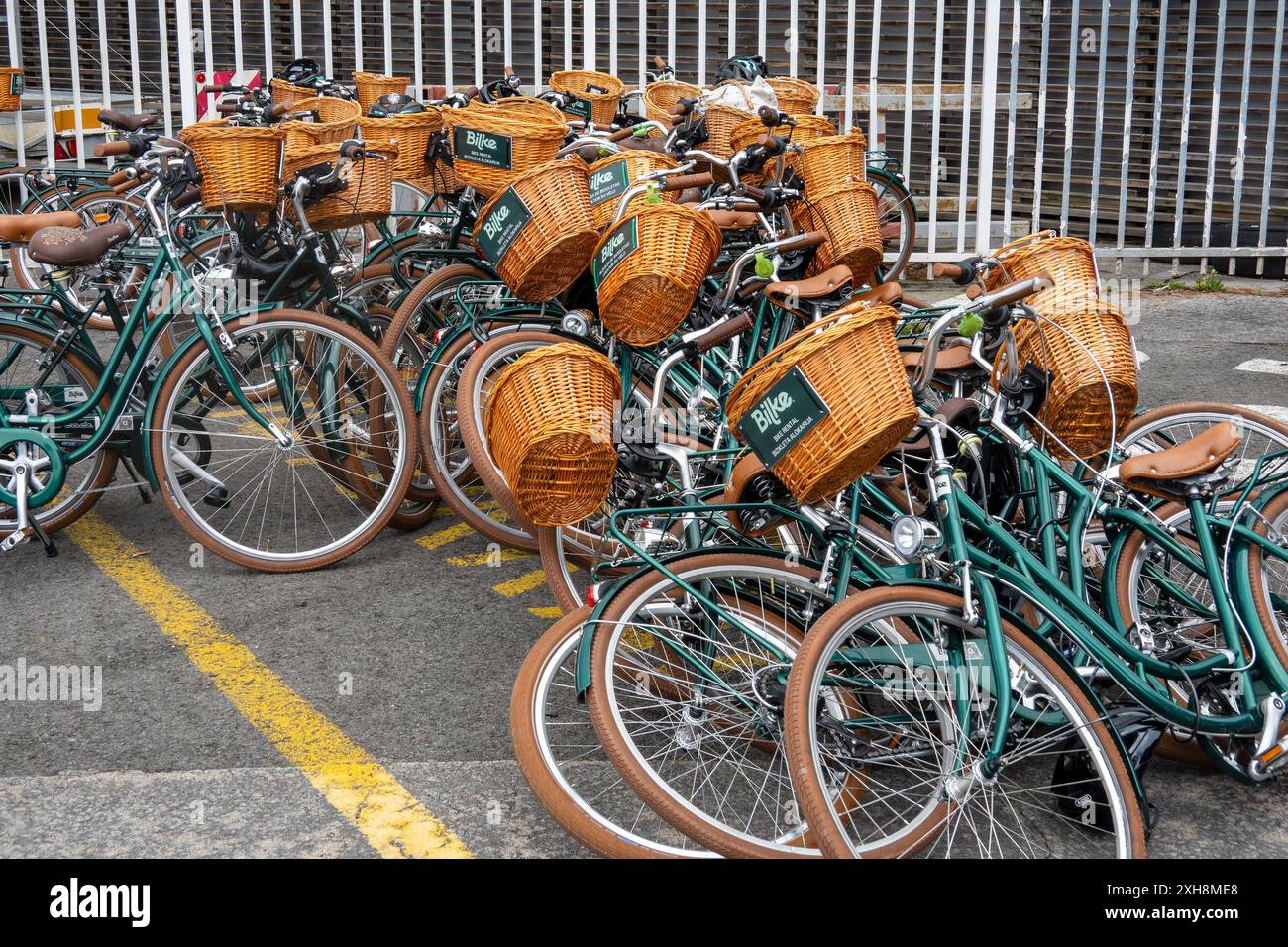 Rental Bicycles Discarded In Getxo, Bilboa, Spain, Bilboa Bike Tours Bicycles With Wicker Baskets,Classic Cruiser Bike Model Berlin British Green Stock Photo