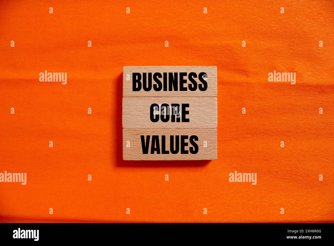 Business core values message written on wooden blocks with orange ...