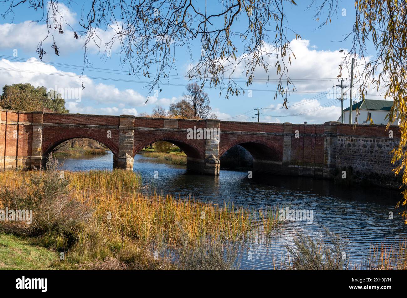 A red brick traffic bridge known as the Red Bridge across the Elizabeth River in Campbell Town, Tasmania, Australia.   The town is rich in convict his Stock Photo