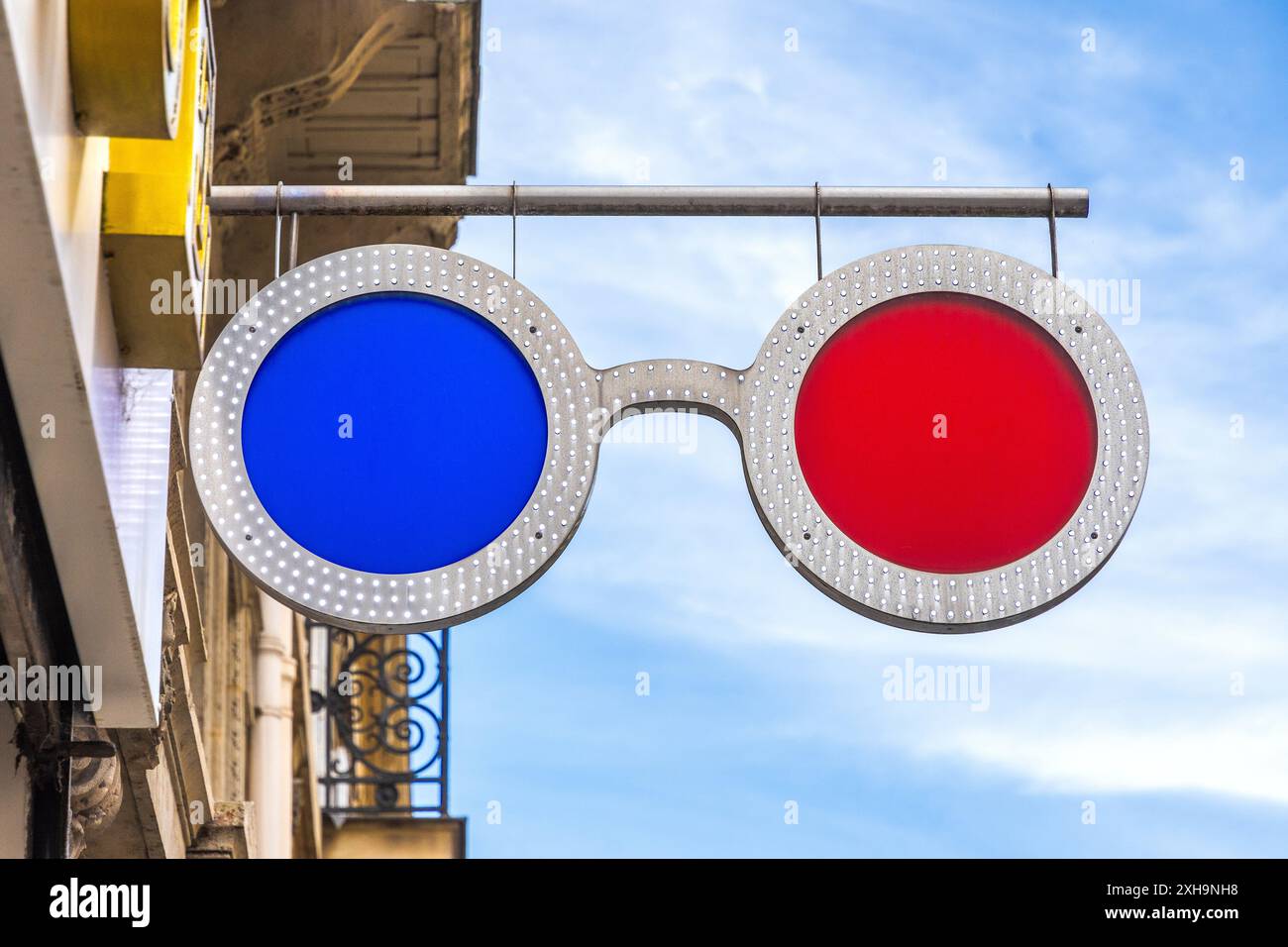 Hanging sign for optician - Paris 75007, France. Stock Photo